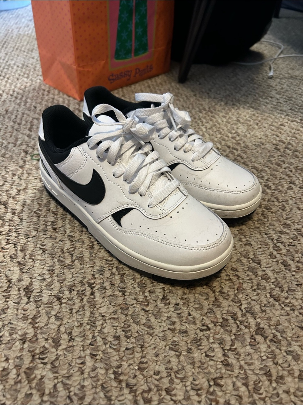 Nike White and Black Low-Top Sneakers with Black Swoosh